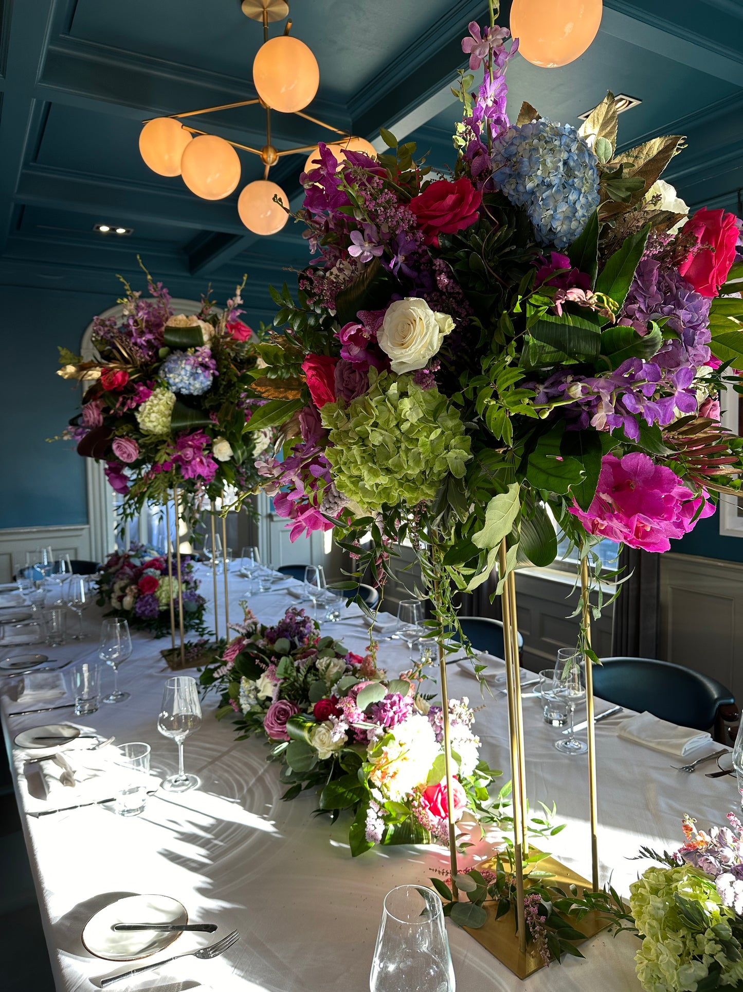 Tall Floral Centerpiece on Raised Gold Frame